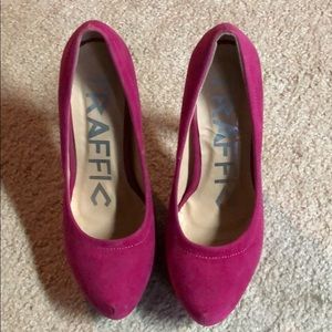 Pink suede pumps